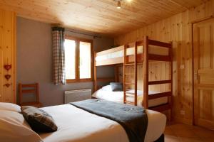 Llit o llits en una habitació de Maison Gauthier