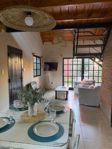 a living room with a table with plates on it at Loft del centro Saladillo in Saladillo