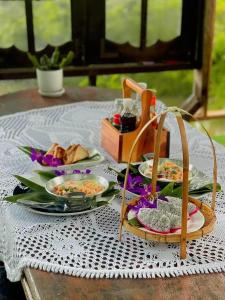 a table with plates of food on top of it at Baancherda in Ban Nong Hu +10 photos