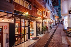 an empty street in a city at night at Avraham Hotels in Machu Picchu