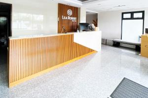 a lobby of a library with a reception desk at Lea Robert Hotel Angeles City in Angeles