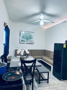 a living room with a couch and a table at Adonai in Rincon de Guayabitos