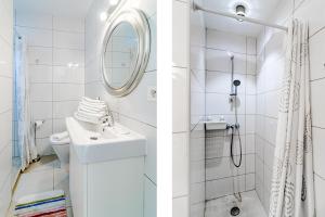 a white bathroom with a sink and a shower at CP - Modern Beachside Apartment in Estepona in Estepona +40 photos