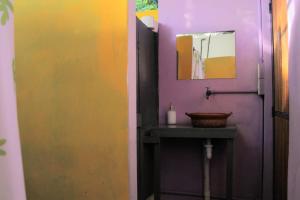 a bathroom with a sink and a mirror at Mantra Homestay in Bacalar +48 photos