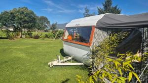 a tent sitting on the grass in a yard at Boutique Retro Caravan in Westport