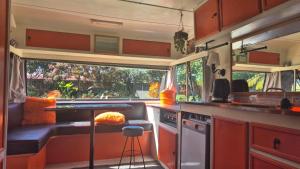 an rv kitchen with a counter and a sink at Boutique Retro Caravan in Westport