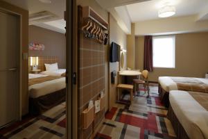 Postel nebo postele na pokoji v ubytování Hotel Monte Hermana Kobe Amalie