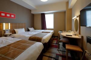 Postel nebo postele na pokoji v ubytování Hotel Monte Hermana Kobe Amalie