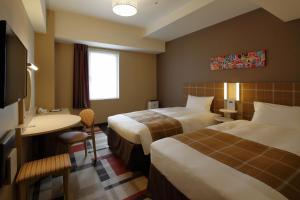 Postel nebo postele na pokoji v ubytování Hotel Monte Hermana Kobe Amalie