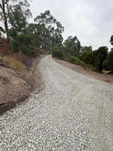 a gravel road with trees on the side of it at Private Accommodation at the Megaranch in Nyora
