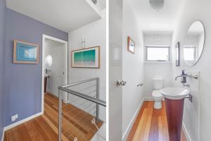 a bathroom with a sink and a toilet at Hyams Reflections Hyams Beach in Hyams Beach +38 photos