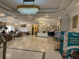 a lobby of a store with a chandelier at City Oasis Boutique Hotel in Lahore