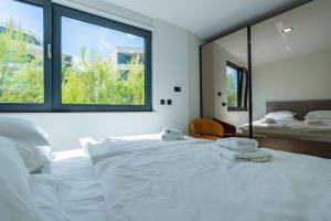 a bedroom with two beds and a large window at Korcula Hill in Korčula +207 photos