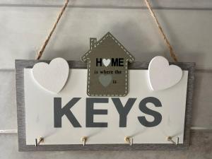 a sign that says keys with a house and hearts at Spitaki in Kremasti +27 photos