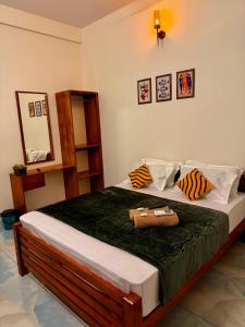 a bedroom with a bed with a purse on it at hello 6 cliff stay varkalacliff - cozy rooms , couple friendly ,family ,group rooms in Varkala