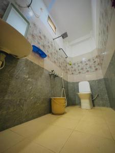 a bathroom with a shower and a toilet in it at De Township beach in Pondicherry +27 photos
