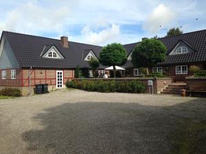 a house with a large driveway in front of it at Country B&B Horsens in Horsens
