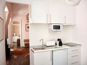 A cozinha ou kitchenette de Fullest Apartments