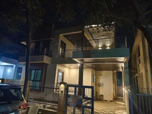 a building with a car parked in front of it at Elite Villa Raipur - Luxury Homestay in Raipur