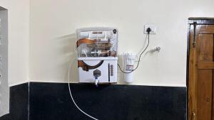 a coffee maker on a counter in a room at Elite Villa Raipur - Luxury Homestay in Raipur