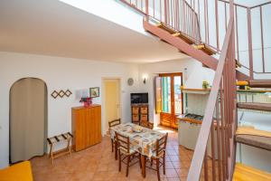 a kitchen and dining room with a table and chairs at La Casa Dei Venti in Amalfi