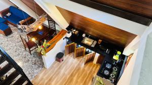 an overhead view of a living room with a couch and a table at Thesrilankaman village in Unawatuna