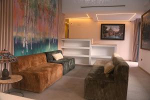 a living room with two couches and a couch at ND Hoteles in Valdemoro