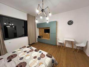a bedroom with a bed and a table and a desk at Bazaleti Heaven in Bazalet'i +7 photos
