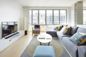 a living room with a couch and a table at ATeRIAN GAZTETAPE II in Getaria