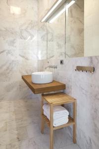 a bathroom with a sink on a wooden table at ATeRIAN GAZTETAPE II in Getaria +47 photos