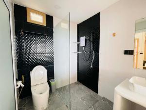 a bathroom with a shower and a toilet and a sink at Big Fish Resort Koh Tao in Ko Tao +126 photos