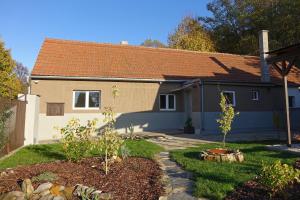a house with a garden with two trees in the yard at Chalupa Kdovíkde in Budyně nad Ohří +64 photos