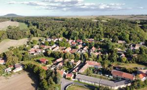 an aerial view of a small town with trees at Chalupa Kdovíkde in Budyně nad Ohří