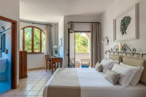a bedroom with a large bed in a room at Hotel Montecallini - Adult Only 14 in Leuca +139 photos