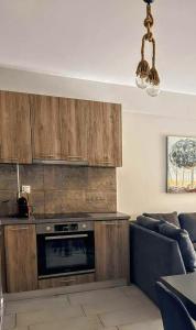 a living room with a couch and a kitchen at EXOTIC LUXURY APARTMENT in Nikiana +9 photos