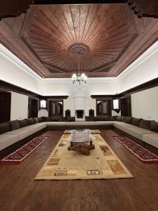 a large living room with a couch and a table at Shkodra Hostel & Day Tours in Shkodër