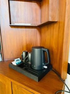 a coffee maker sitting on top of a counter at Ranmin Lake Weerawila in Weerawila