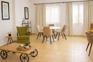 a living room with a table and chairs at Navigo house Vrachati in Vrachati