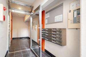 a walk in shower in a room with a glass door at ライズ201 in Kasugai +20 photos