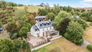 an aerial view of a large white house at Oak View in Rhayader +15 photos