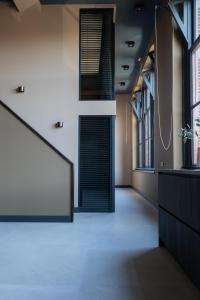 an office with a hallway with a large window at Park Lofts Groningen in Groningen