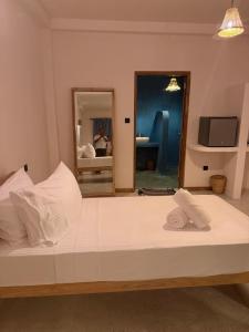a large bed in a room with a mirror at Sea Station in Habaraduwa Central +13 photos