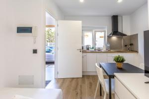 a kitchen with a table and a dining room at Charming Street Studio in Tegueste in Santa Cruz de Tenerife