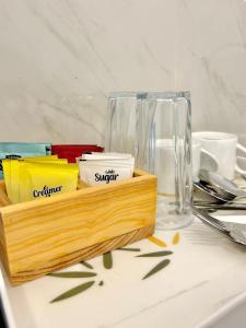a wooden tray filled with differentiatesiatesiatesiatesiatesiatesktop at Rufero Transit Hotel in Katunayaka
