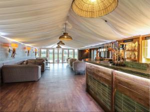 a lobby with a bar and a living room at Glamping Tri Pod 2 - Gower in Swansea