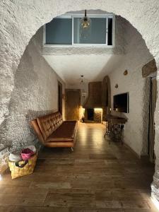 a living room with a couch and a table at El Refugio de Juncalillo in Gáldar