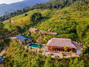 an aerial view of a house on a hill at TV Palm Ecolodge Ha Giang in Ha Giang