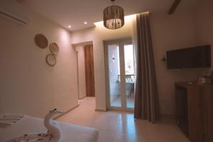 a bedroom with a swan on the bed and a television at Voyage On The Spot in Cairo +40 photos