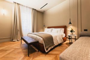 a bedroom with a large bed and a window at Lenel Boutique Room - La Foresteria in Brescia
