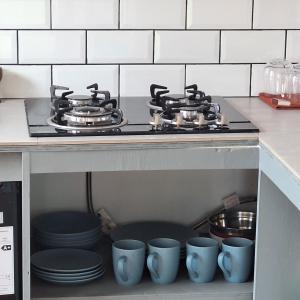 a stove top oven sitting inside of a kitchen at Cabaña Roquin Patagonia in Chile Chico
